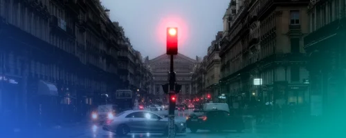 Red traffic light on a busy street