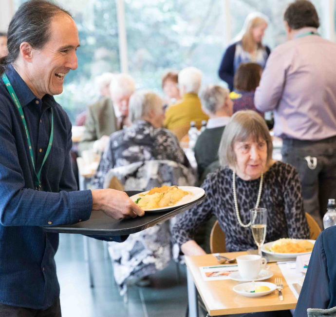 Richard Tang serving Christmas Meal to HMRC